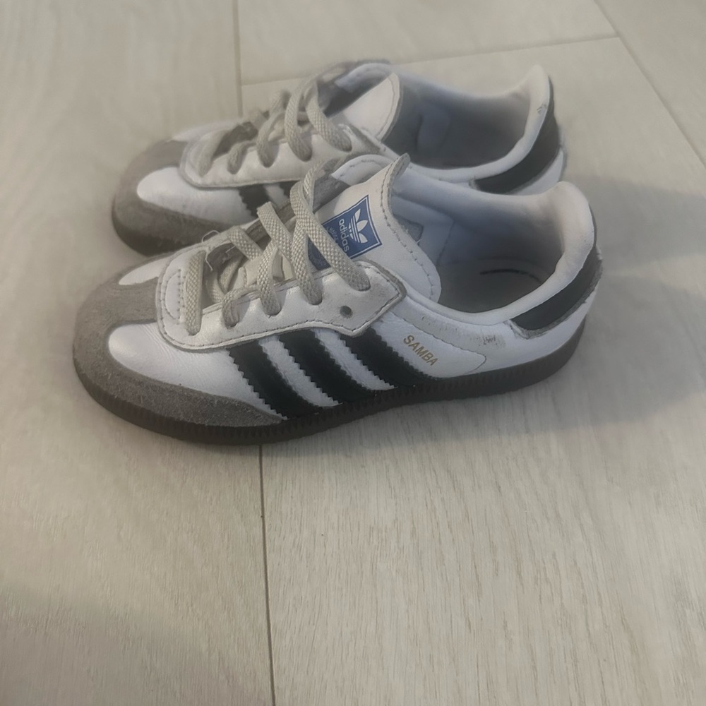 Adidas White and Black Sneakers with Iconic Stripes